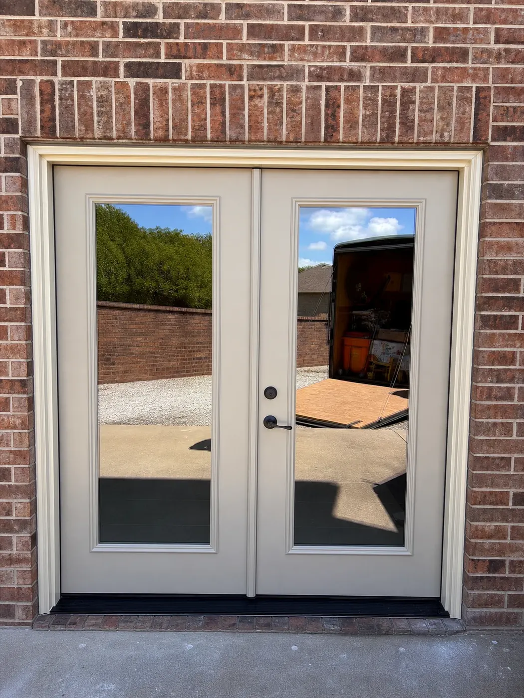After: full glass patio doors bring a cleaner view and a brighter opening.